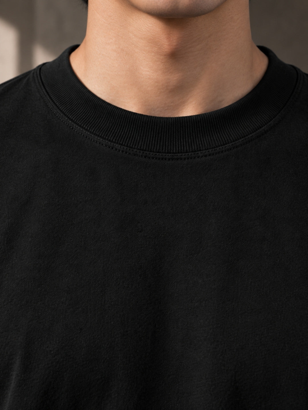 Black boxy t-shirt collar detail